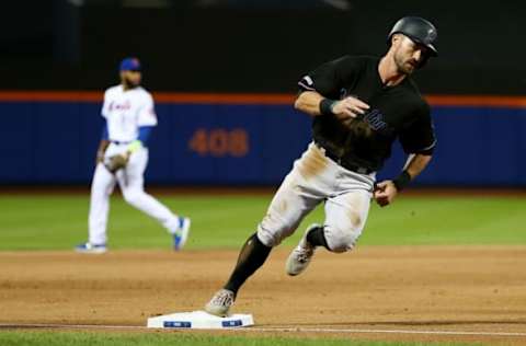 NEW YORK, NEW YORK – MAY 11: Jon Berti #55 of the Miami Marlins scores on Sandy Alcantara #22 RBI doubles to left in the third inning against the New York Mets at Citi Field on May 11, 2019 in New York City. (Photo by Mike Stobe/Getty Images)