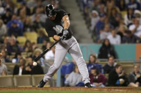 LOS ANGELES – MAY 28: Pinch hitter Wes Helms #18 of the Florida Marlins hits a two RBI double down the first base line in the sixth inning against the Los Angeles Dodgers on May 28, 2011 at Dodger Stadium in Los Angeles, California. (Photo by Stephen Dunn/Getty Images)