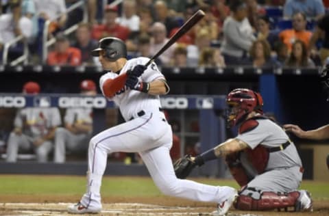 MIAMI, FL – JUNE 12: Martin Prado #14 of the Miami Marlins singles in the second inning against the St. Louis Cardinals at Marlins Park on June 12, 2019 in Miami, Florida. (Photo by Eric Espada/Getty Images)