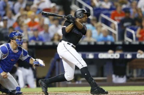 MIAMI, FLORIDA – JULY 12: Curtis Granderson #21 of the Miami Marlins hits a 2-run home run in the third inning against the New York Mets at Marlins Park on July 12, 2019 in Miami, Florida. (Photo by Michael Reaves/Getty Images)