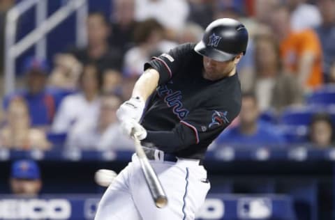 MIAMI, FLORIDA – JULY 13: Neil Walker #18 of the Miami Marlins singles in the first inning against the New York Mets at Marlins Park on July 13, 2019 in Miami, Florida. (Photo by Michael Reaves/Getty Images)