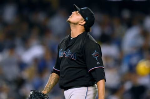 LOS ANGELES, CALIFORNIA – JULY 19: Jose Quijada #74 of the Miami Marlins reacts to the third Los Angeles Dodgers out during the seventh inning at Dodger Stadium on July 19, 2019 in Los Angeles, California. (Photo by Harry How/Getty Images)