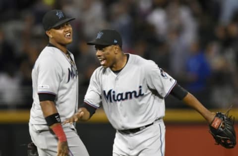 CHICAGO, ILLINOIS – JULY 24: Starlin Castro #13 of the Miami Marlins and Curtis Granderson #21 of the Miami Marlins celebrate the 2-0 win against the Chicago White Sox at Guaranteed Rate Field on July 24, 2019 in Chicago, Illinois. (Photo by Quinn Harris/Getty Images)