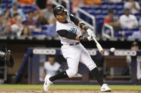 MIAMI, FLORIDA – JULY 27: Starlin Castro #13 of the Miami Marlins hits a double in the first inning against the Arizona Diamondbacks at Marlins Park on July 27, 2019 in Miami, Florida. (Photo by Michael Reaves/Getty Images)