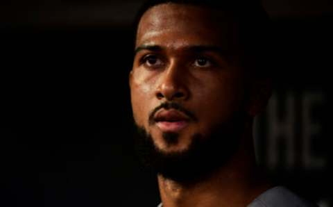 ATLANTA, GEORGIA – AUGUST 22: Sandy Alcantara #22 of the Miami Marlins sits in the dugout after pitching seven innings against the Atlanta Braves at SunTrust Park on August 22, 2019 in Atlanta, Georgia. (Photo by Logan Riely/Getty Images)