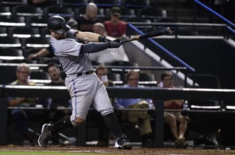 PHOENIX, ARIZONA – SEPTEMBER 17: Bryan Holaday #28 of the Miami Marlins hits an RBI single in the fifth inning of the MLB game against the Arizona Diamondbacks at Chase Field on September 17, 2019 in Phoenix, Arizona. (Photo by Jennifer Stewart/Getty Images)