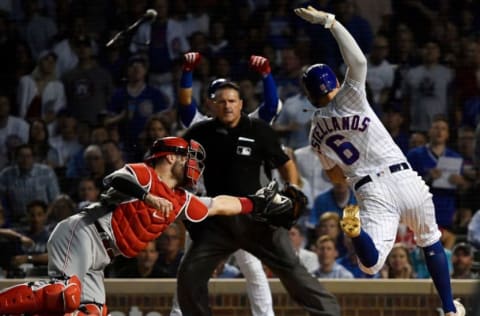 CHICAGO, ILLINOIS – SEPTEMBER 18: Nicholas Castellanos #6 of the Chicago Cubs beats the tag from Curt Casali #12 of the Cincinnati Reds to score in the fourth inning at Wrigley Field on September 18, 2019 in Chicago, Illinois. (Photo by Quinn Harris/Getty Images)