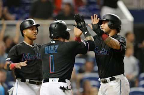 MIAMI, FLORIDA – SEPTEMBER 21: Harold Ramirez #47 of the Miami Marlins celebrates with Starlin Castro #13 and Isan Diaz #1 against the Washington Nationals in the eighth inning at Marlins Park on September 21, 2019 in Miami, Florida. (Photo by Michael Reaves/Getty Images)