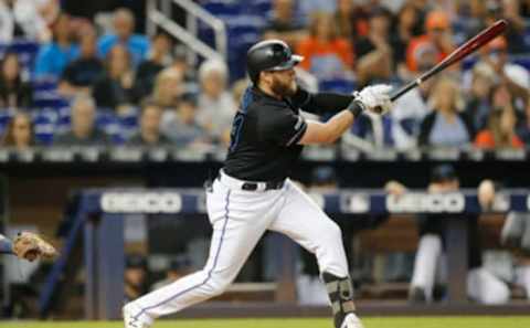 MIAMI, FLORIDA – SEPTEMBER 21: Austin Dean #44 of the Miami Marlins hits a 3-RBI double in the eighth inning against the Washington Nationals at Marlins Park on September 21, 2019, in Miami, Florida. (Photo by Michael Reaves/Getty Images)