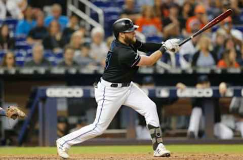 MIAMI, FLORIDA – SEPTEMBER 21: Austin Dean #44 of the Miami Marlins hits a 3-RBI double in the eighth inning against the Washington Nationals at Marlins Park on September 21, 2019 in Miami, Florida. (Photo by Michael Reaves/Getty Images)