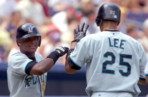 Florida Marlins’ Luis Castillo (L) congratulates Derrek Lee. (Photo by STEVE SCHAEFER/AFP via Getty Images)