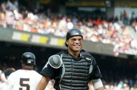 Ivan Rodriguez #7 of the Florida Marlins smiles after the Marlins won Game 2 of the NLDS against the San Francisco Giants at Pac Bell Park in San Francisco, Calif., October 1, 2003 (Photo by Tom Hauck/Getty Images)