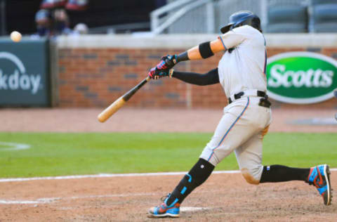 ATLANTA, GEORGIA – SEPTEMBER 07: Miguel Rojas #19 of the Miami Marlins hits an RBI double during the 10th inning against the Atlanta Braves at Truist Park on September 7, 2020 in Atlanta, Georgia. (Photo by Carmen Mandato/Getty Images)