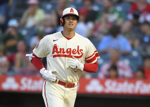 ANAHEIM, CA – AUGUST 02: Shohei Ohtani #17 of the Los Angeles Angels jogs to the dugout after fllying out against the Oakland Athletics in the third inning at Angel Stadium of Anaheim on August 2, 2022 in Anaheim, California. (Photo by John McCoy/Getty Images)