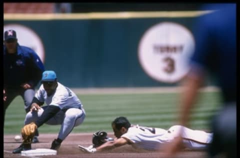 18 Jun 1996: Third baseman Terry Pendleton of the Florida Marlins attempts to catch out centerfielder Stan Javier of the San Francisco Giants during a game at 3Com Park in San Francisco, California. The Giants won the game, 9-8. Mandatory Credit: Otto G