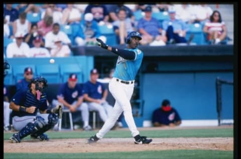 7 Mar 1997: Center fielder Devon White of the Florida Marlins hits the ball during a game against the Cleveland Indians at Space Coast Stadium in Viera, Florida. The Marlins won the game 11-5. Mandatory Credit: Stephen Dunn /Allsport