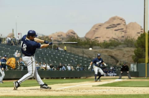 PHOENIX – MARCH 5: Wes Helms #18 of the Milwaukee Brewers bats in a run against the Oakland A’s on March 5, 2004 at Phoenix Municipal Stadium in Phoenix, Arizona. The Brewers won 4-3. (Photo by Brian Bahr/Getty Images)