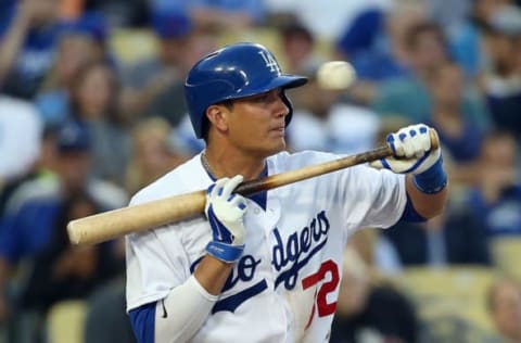 LOS ANGELES, CA – JUNE 16: Miguel Rojas #72 of the Los Angeles Dodgers holds back on his bunt attempt in the second inning during the MLB game against the Colorado Rockies at Dodger Stadium on June 16, 2014 in Los Angeles, California. (Photo by Victor Decolongon/Getty Images)