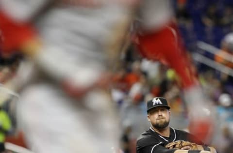 MIAMI, FL – JULY 11: Third baseman Casey McGehee #5 of the Miami Marlins throws out a Cincinnati Reds baserunner during their game at Marlins Park on July 11, 2015 in Miami, Florida. (Photo by Joe Skipper/Getty Images)