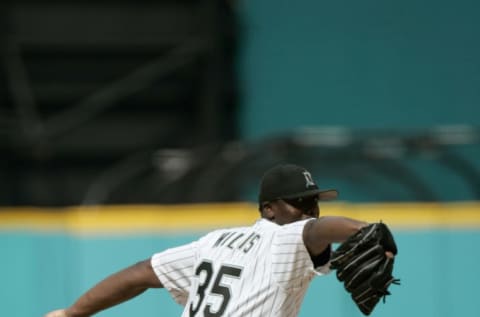 MIAMI – JULY 11: Pitcher Dontrelle Willis #35 of the Florida Marlins reaches back as he prepares to throw a pitch during the game against the New York Mets at Pro Player Stadium on July 11, 2004 in Miami, Florida. The Marlins defeated the Mets 5-2. (Photo by Eliot J. Schechter/Getty Images)