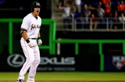 MIAMI, FLORIDA – APRIL 05: Derek Dietrich #32 of the Miami Marlins reeacts to an RBI double in the ninth inning during 2016 Opening Day against the Detroit Tigers at Marlins Park on April 5, 2016 in Miami, Florida. (Photo by Mike Ehrmann/Getty Images)