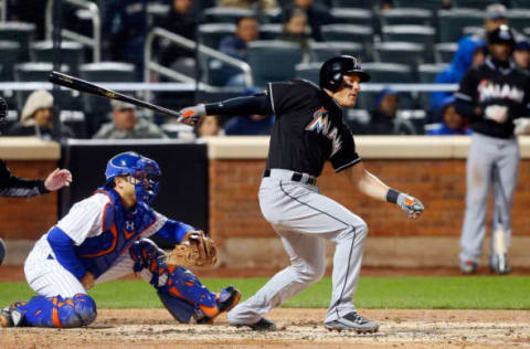 NEW YORK, NY – APRIL 12: Derek Dietrich #32 of the Miami Marlins follows through on a fourth inning RBI base hit against the New York Mets at Citi Field on April 12, 2016 in the Flushing neighborhood of the Queens borough of New York City. (Photo by Jim McIsaac/Getty Images)