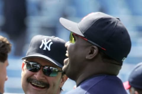 NEW YORK – APRIL 6: David Ortiz of the Boston Red Sox shares a laugh with New York Yankees hitting coach Don Mattingly during batting practice before their game at Yankee Stadium April 6, 2005 in the Bronx borough of New York City. (Photo by Jim McIsaac/Getty Images)