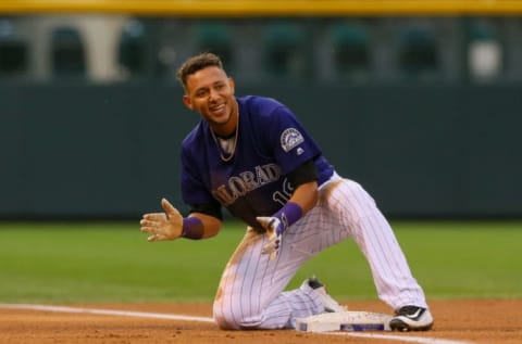 DENVER, CO – AUGUST 31: Cristhian Adames #18 of the Colorado Rockies smiles after sliding into third base with a triple during the first inning against the Los Angeles Dodgers at Coors Field on August 31, 2016 in Denver, Colorado. (Photo by Justin Edmonds/Getty Images)