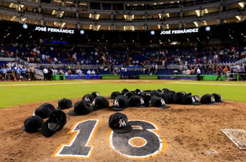 MIAMI, FL – SEPTEMBER 26: Miami Marlins leave their hats on the pitching mound to honor the late Jose Fernandez. (Photo by Rob Foldy/Getty Images)