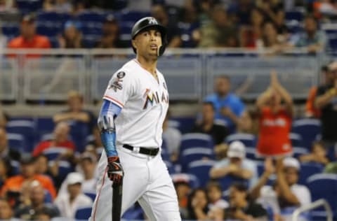 MIAMI, FL – OCTOBER 1: Giancarlo Stanton #27 of the Miami Marlins walks to the dugout striking out in the ninth inning of play against the Atlanta Braves, ending his bid for 60 home runs for the season at Marlins Park on October 1, 2017 in Miami, Florida. (Photo by Joe Skipper/Getty Images)