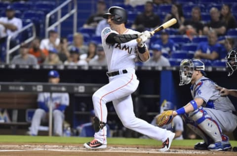 MIAMI, FL – MAY 16: Martin Prado #14 of the Miami Marlins singles in the first inning of the game against the Los Angeles Dodgers at Marlins Park on May 16, 2018 in Miami, Florida. (Photo by Eric Espada/Getty Images)