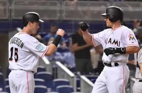 MIAMI, FL – JUNE 11: J.T. Realmuto #11 of the Miami Marlins is congratulated by Brian Anderson #15 after hitting a home run in the seventh inning against the San Francisco Giants at Marlins Park on June 11, 2018 in Miami, Florida. (Photo by Eric Espada/Getty Images)