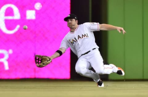 MIAMI, FL – JUNE 12: J.B. Shuck #3 of the Miami Marlins makes a catch in the outfield off the bat of Joe Panik #12 of the San Francisco Giants during the third inning of the game at Marlins Park on June 12, 2018 in Miami, Florida. (Photo by Eric Espada/Getty Images)