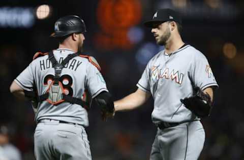 SAN FRANCISCO, CA – JUNE 18: Kyle Barraclough #46 shakes hands with Bryan Holaday #28 after they beat the San Francisco Giants at AT&T Park on June 18, 2018 in San Francisco, California. (Photo by Ezra Shaw/Getty Images)