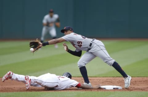 CLEVELAND, OH – JUNE 23: Jose Ramirez #11 of the Cleveland Indians dives back to second base ahead of the throw to Dixon Machado #49 of the Detroit Tigers in the first inning at Progressive Field on June 23, 2018 in Cleveland, Ohio. (Photo by Joe Robbins/Getty Images)