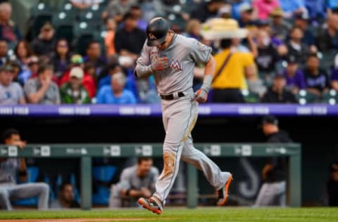 DENVER, CO – JUNE 24: Derek Dietrich #32 of the Miami Marlins begins to celebrate after hitting a second inning solo homerun against the Colorado Rockies at Coors Field on June 24, 2018 in Denver, Colorado. (Photo by Dustin Bradford/Getty Images)