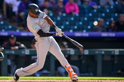 DENVER, CO – JUNE 24: Lewis Brinson #9 of the Miami Marlins hits a seventh inning RBI triple against the Colorado Rockies at Coors Field on June 24, 2018 in Denver, Colorado. (Photo by Dustin Bradford/Getty Images)