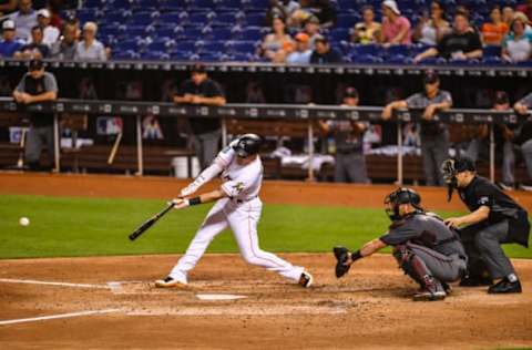 MIAMI, FL – JUNE 25: Derek Dietrich #32 of the Miami Marlins singles for an RBI in the fourth inning during the game against the Arizona Diamondbacks at Marlins Park on June 25, 2018 in Miami, Florida. (Photo by Mark Brown/Getty Images)