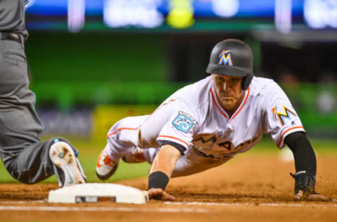 MIAMI, FL – JUNE 26: Brian Anderson #15 of the Miami Marlins dives back to first base in the seventh inning during the game against the Arizona Diamondbacks at Marlins Park on June 26, 2018 in Miami, Florida. (Photo by Mark Brown/Getty Images)