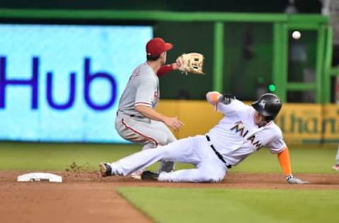 MIAMI, FL – JULY 15: Garrett Cooper #30 of the Miami Marlins slides into second base after hitting a double during the second inning against the Philadelphia Phillies at Marlins Park on July 15, 2018 in Miami, Florida. (Photo by Eric Espada/Getty Images)