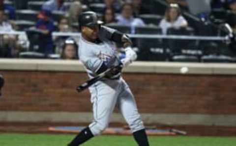 NEW YORK, NY – MAY 23: Starlin Castro #13 of the Miami Marlins drives in a run against the New York Mets in the ninth inning during their game at Citi Field on May 23, 2018 in New York City. (Photo by Al Bello/Getty Images)