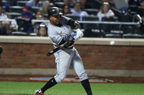 NEW YORK, NY – MAY 23: Starlin Castro #13 of the Miami Marlins drives in a run against the New York Mets in the ninth inning during their game at Citi Field on May 23, 2018 in New York City. (Photo by Al Bello/Getty Images)