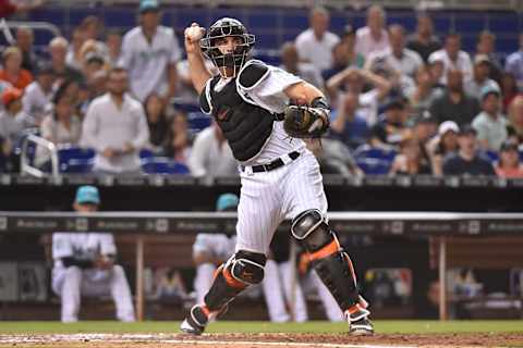 MIAMI, FL – JUNE 8: J.T. Realmuto #11 of the Miami Marlins throws towards first base on a double play in the sixth inning against the San Diego Padres at Marlins Park on June 8, 2018 in Miami, Florida. (Photo by Eric Espada/Getty Images)