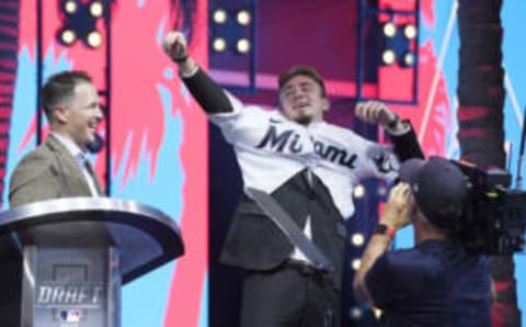 LOS ANGELES, CA – JULY 17: Jacob Miller puts on the jersey with Chris Coghlan looking after getting picked 46th by the Miami Marlins during the second round at the 2022 MLB Draft at XBOX Plaza on July 17, 2022 in Los Angeles, California. (Photo by Kevork Djansezian/Getty Images)