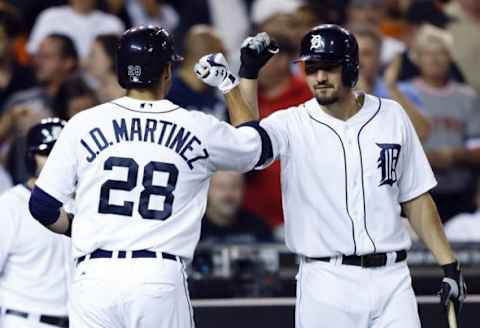 Sep 9, 2014; Detroit, MI, USA; Detroit Tigers left fielder J.D. Martinez (28) receives congratulations from third baseman Nick Castellanos (9) after he hit a home run in the fifth inning against the Kansas City Royals at Comerica Park. Mandatory Credit: Rick Osentoski-USA TODAY Sports