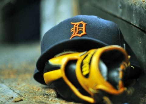 Sep 28, 2013; Miami, FL, USA; A detail shot of Detroit Tigers baseball cap and glove on the steps of the dugout during a game against the Miami Marlins at Marlins Park. Mandatory Credit: Steve Mitchell-USA TODAY Sports