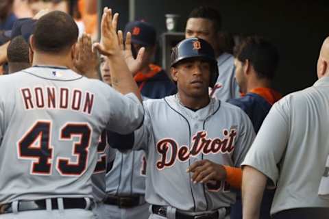 Jul 30, 2015; Baltimore, MD, USA; Detroit Tigers left fielder Yoenis Cespedes (52) celebrates with teammates in the dugout after scoring a run in the first inning against the Baltimore Orioles at Oriole Park at Camden Yards. Mandatory Credit: Tommy Gilligan-USA TODAY Sports