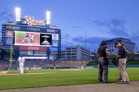 Aug 7, 2015; Detroit, MI, USA; A general view as umpires James Hoye (92) and Ted Barrett (65) go to a replay review in the fourth inning during the game between the Detroit Tigers and the Boston Red Sox at Comerica Park. Mandatory Credit: Rick Osentoski-USA TODAY Sports