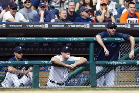 May 22, 2014; Detroit, MI, USA; Detroit Tigers starting pitcher Rick Porcello (left) starting pitcher Max Scherzer (center) and starting pitcher Justin Verlander (right) watch from the dugout as Danny Worth (not pictured) pitches in the ninth inning against the Texas Rangers at Comerica Park. Texas won 9-2. Mandatory Credit: Rick Osentoski-USA TODAY Sports