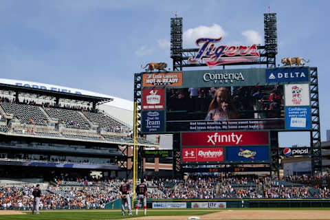 Sep 6, 2015; Detroit, MI, USA; Cleveland Indians second baseman Jason Kipnis (22) and shortstop Francisco Lindor (12) during the singing of God Bless America at the seventh inning stretch of the game against the Detroit Tigers at Comerica Park. Mandatory Credit: Rick Osentoski-USA TODAY Sports